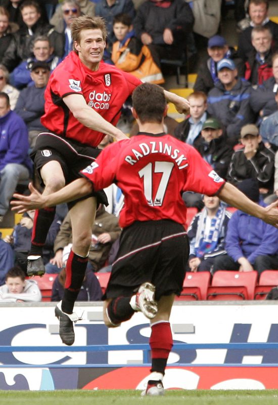 Fulham's Brian McBride, left, celebrates scoring against Blackburn Rovers with teammate Tomasz Radzinski during their English Premier League soccer match at Ewood Park Stadium, Blackburn, England, Saturday May 7, 2005. (AP Photo/Jon Super) ** NO INTERNET/MOBILE USAGE WITHOUT FAPL LICENCE - SEE IPTC SPECIAL INSTRUCTIONS FIELD FOR DETAILS **